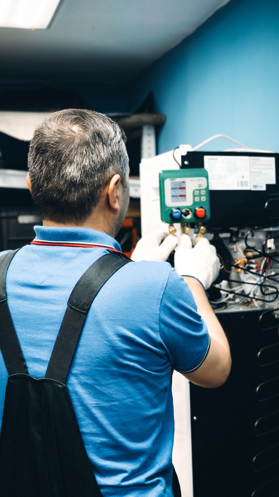 South Bay Heating & Air technician servicing an indoor HVAC unit